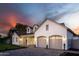 An exterior showcasing a clean garage with arched entryway, paver driveway, and manicured landscaping at 3634 N 47Th St, Phoenix, AZ 85018