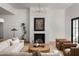 Bright living room with a fireplace, stylish furnishings, and hardwood floors at 3634 N 47Th St, Phoenix, AZ 85018
