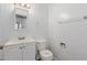 Well-lit bathroom features a modern toilet, vanity, and mirror for a clean look at 3644 W Townley Ave, Phoenix, AZ 85051
