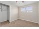 This cozy bedroom features a closet, ceiling fan, and a window for natural light at 3644 W Townley Ave, Phoenix, AZ 85051