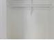 White closet with a rod and shelves provides functional and organized storage space at 3644 W Townley Ave, Phoenix, AZ 85051