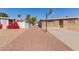 Single-story brick home with a basketball hoop and long driveway at 3644 W Townley Ave, Phoenix, AZ 85051