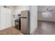 Kitchen includes stainless fridge and gas range oven at 3644 W Townley Ave, Phoenix, AZ 85051