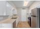 Efficient kitchen features stainless steel appliances and ample storage at 3644 W Townley Ave, Phoenix, AZ 85051