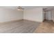 Spacious living room featuring modern flooring, ample natural light, and neutral wall color at 3644 W Townley Ave, Phoenix, AZ 85051