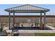 Shaded picnic area with picnic tables and a grill, perfect for community gatherings at 3819 S 87Th Dr, Tolleson, AZ 85353