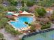 Aerial shot of community pool, seating, and lush landscaping, in a vibrant residential neighborhood at 4076 W Painted Horse Dr, Eloy, AZ 85131