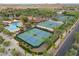 Aerial shot of community pool, tennis courts, and lush landscaping, in a residential neighborhood at 4076 W Painted Horse Dr, Eloy, AZ 85131