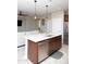 Kitchen island with modern appliances seamlessly connects to the living area in this open layout at 4076 W Painted Horse Dr, Eloy, AZ 85131