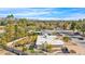 Expansive aerial view showcasing a property with a backyard pool, lush landscaping, and stunning mountain views at 4114 E Desert Cove Ave, Phoenix, AZ 85028