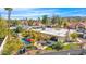 Aerial view of backyard pool with a lounge area, outdoor dining, and lush landscaping at 4114 E Desert Cove Ave, Phoenix, AZ 85028