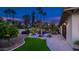 This home features a lush backyard with a pool, mature trees, and outdoor seating areas at 4114 E Desert Cove Ave, Phoenix, AZ 85028