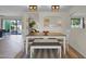 Open-concept dining room with modern lighting and views to living spaces at 4114 E Desert Cove Ave, Phoenix, AZ 85028