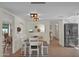 Light and airy dining room featuring a stainless steel refrigerator and neutral color palette at 4114 E Desert Cove Ave, Phoenix, AZ 85028