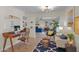 Open living area features a home office, stylish furnishings and neutral tones at 4114 E Desert Cove Ave, Phoenix, AZ 85028