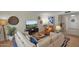 Inviting living room featuring a large sectional sofa and entertainment area with a TV at 4114 E Desert Cove Ave, Phoenix, AZ 85028