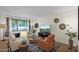 Comfortable living room with a large window, stylish rug, and modern decor at 4114 E Desert Cove Ave, Phoenix, AZ 85028
