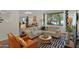 Spacious living room with comfortable seating, modern decor, and large windows at 4114 E Desert Cove Ave, Phoenix, AZ 85028