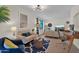 Bright living room with modern lighting, comfortable seating, and stylish decor accents at 4114 E Desert Cove Ave, Phoenix, AZ 85028
