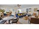 Bright living room features a blue sectional sofa, wood ceiling fan and open floor plan at 4114 E Desert Cove Ave, Phoenix, AZ 85028