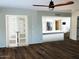 Inviting living room features wood floors and flows into a modern kitchen with stainless steel appliances at 4114 E Desert Cove Ave, Phoenix, AZ 85028