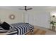 Cozy main bedroom featuring minimalist décor, ensuite, and ample closet space at 4114 E Desert Cove Ave, Phoenix, AZ 85028