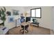 Functional home office space with modern desk, ergonomic chair, and bright window at 4114 E Desert Cove Ave, Phoenix, AZ 85028