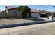 Charming single-story home featuring a brick facade, metal roof, and well-maintained front yard at 4115 W Sierra St, Phoenix, AZ 85029