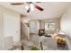 Inviting living room featuring a cozy seating area, stairs, and a well-lit dining space at 4691 E Torrey Pines Ln, Chandler, AZ 85249