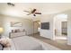 Relaxing main bedroom with a dresser, ensuite, and a ceiling fan for added comfort at 4691 E Torrey Pines Ln, Chandler, AZ 85249