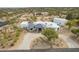 Expansive aerial view of a modern home featuring a circular driveway and meticulously landscaped desert surroundings at 5045 E Calle Del Sol --, Cave Creek, AZ 85331