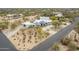 Wide aerial perspective of an estate showing landscaping, desert surroundings, and a long private driveway at 5045 E Calle Del Sol --, Cave Creek, AZ 85331