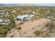 Gorgeous aerial view showcasing a sprawling estate with a sparkling pool and vast desert landscape at 5045 E Calle Del Sol --, Cave Creek, AZ 85331