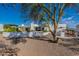 Modern backyard featuring a patio area, manicured landscaping, and outdoor dining under shade, perfect for entertaining at 5045 E Calle Del Sol --, Cave Creek, AZ 85331