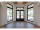 Entryway with large windows, wood floors, and stylish front door at 5045 E Calle Del Sol --, Cave Creek, AZ 85331