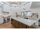 Gourmet kitchen featuring stainless steel appliances, center island, and vaulted ceilings at 5045 E Calle Del Sol --, Cave Creek, AZ 85331