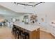 Open kitchen featuring an island with seating and views to the connected living spaces at 5045 E Calle Del Sol --, Cave Creek, AZ 85331