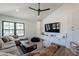 Bright living room featuring vaulted ceilings, large windows, a ceiling fan, and a cozy sectional sofa with a coffee table at 5045 E Calle Del Sol --, Cave Creek, AZ 85331