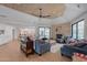 Living room featuring wood ceiling, comfortable seating, and stone fireplace at 5045 E Calle Del Sol --, Cave Creek, AZ 85331