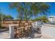 Outdoor kitchen with a grill and bar seating, ideal for entertaining and enjoying outdoor cooking at 5045 E Calle Del Sol --, Cave Creek, AZ 85331