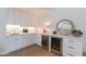 Entertainer's wet bar featuring wine fridges, sink, and ample counter space for storage at 5045 E Calle Del Sol --, Cave Creek, AZ 85331
