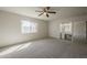 Bright bedroom with a large window, ceiling fan, and a vanity area at 5112 N 83Rd St, Scottsdale, AZ 85250