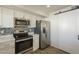 Modern kitchen featuring stainless steel appliances, subway tile backsplash and white cabinets at 5112 N 83Rd St, Scottsdale, AZ 85250