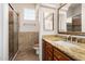 Bathroom featuring a walk-in shower, tile, and a vanity with granite counters at 5303 N 7Th St # 242, Phoenix, AZ 85014