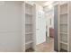 Walk-in closet with lots of built-in shelving located just off the bathroom at 5303 N 7Th St # 242, Phoenix, AZ 85014