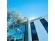 Exterior view of Provision building with glass facade and modern architecture with blue sky at 5303 N 7Th St # 242, Phoenix, AZ 85014