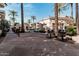 Outdoor grilling area with barbecue grills, surrounded by palms and tropical plants creating an inviting experience at 5303 N 7Th St # 242, Phoenix, AZ 85014
