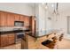 Stylish kitchen featuring granite countertops, stainless steel appliances, and modern pendant lighting fixtures at 5303 N 7Th St # 242, Phoenix, AZ 85014