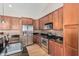 Well-equipped kitchen featuring stainless steel appliances, granite counters, and stylish backsplash at 5303 N 7Th St # 242, Phoenix, AZ 85014