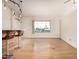 Bright living room boasts light wood floors, a breakfast bar, and large windows with a neighborhood view at 5303 N 7Th St # 242, Phoenix, AZ 85014